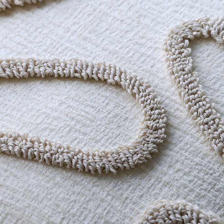 Square decorative cushion cover with hand-tufted loop appliqué and fine linen look