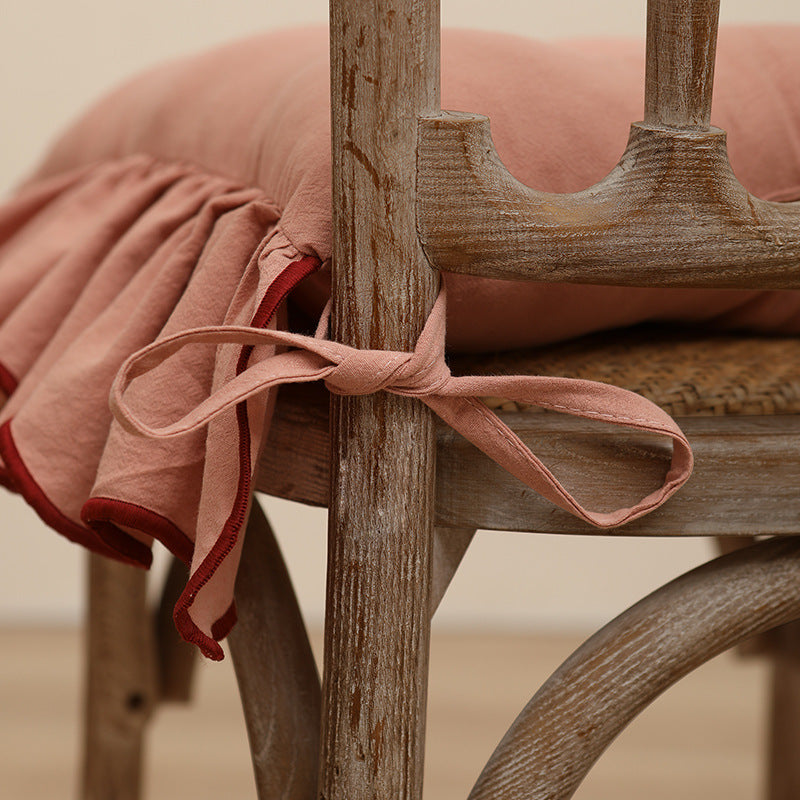 Padded chair cushion with ruffle and ties