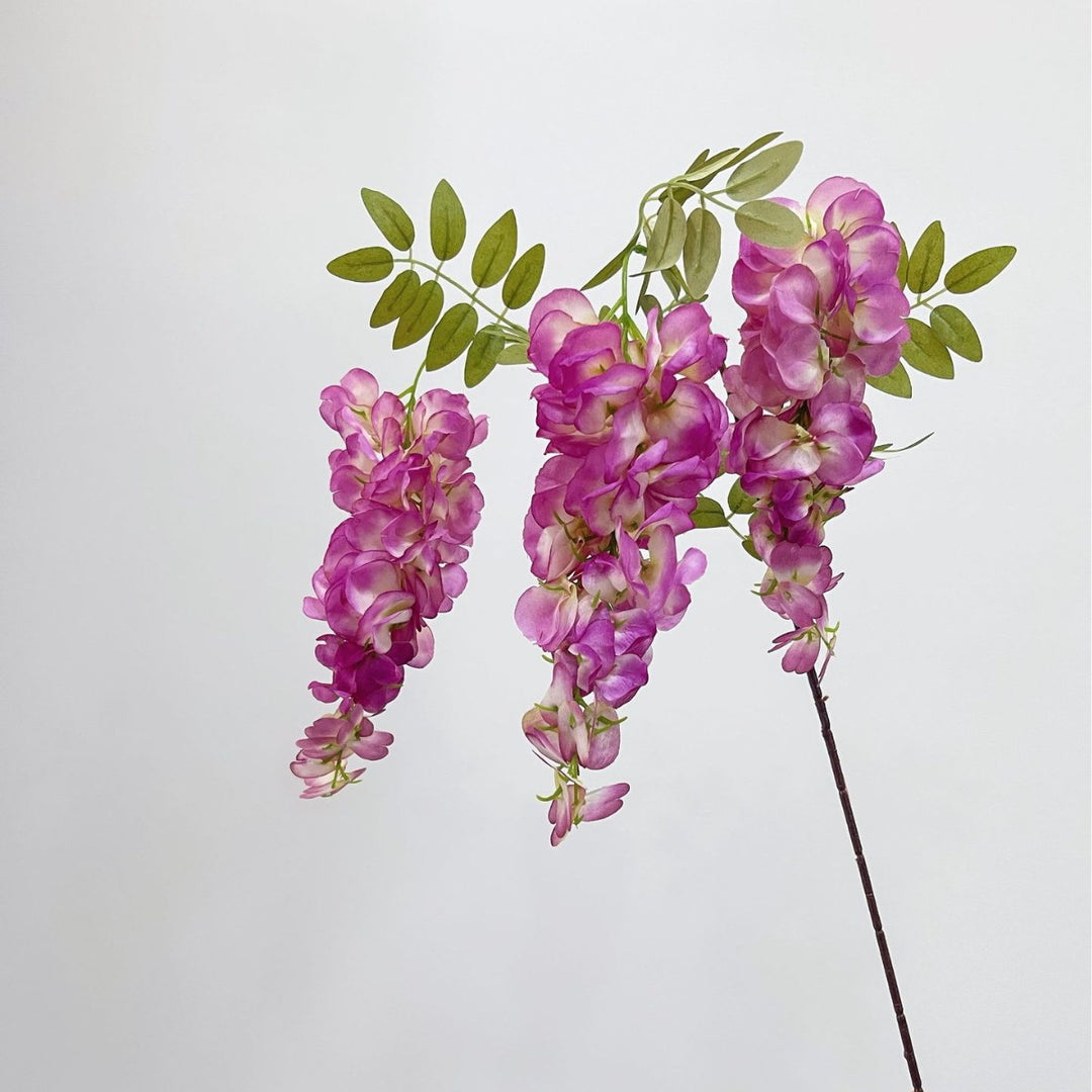 Artificial flower branch with lifelike, hanging flowers