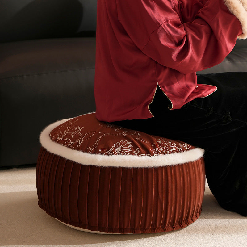 Round velvet floor pouf with floral embroidered top and faux fur trim