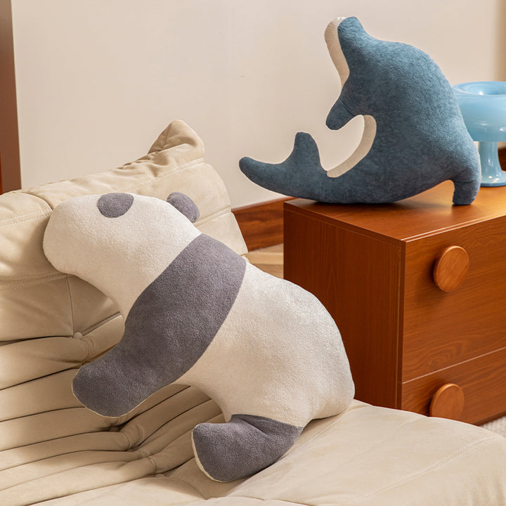 Playful dolphin cuddle pillow with ergonomic neck and arm recess