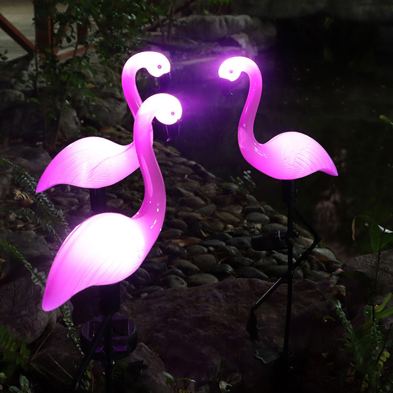 Decorative solar-powered flamingo garden stake with adjustable tray and spike attachment