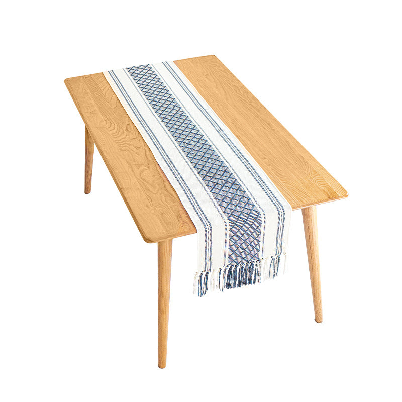 Handwoven cotton table runner with ethnic diamond pattern and fringes