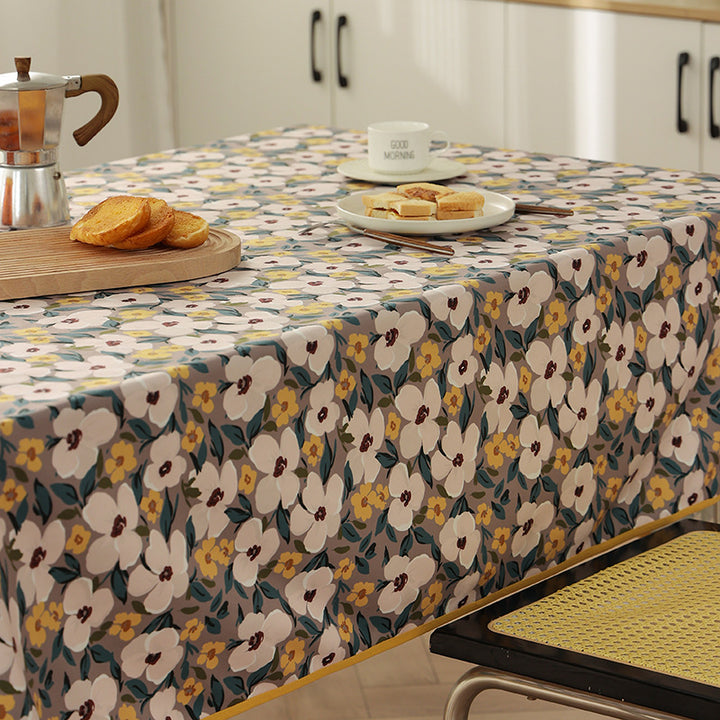 Coated tablecloth in country house style with botanical print and fine hem