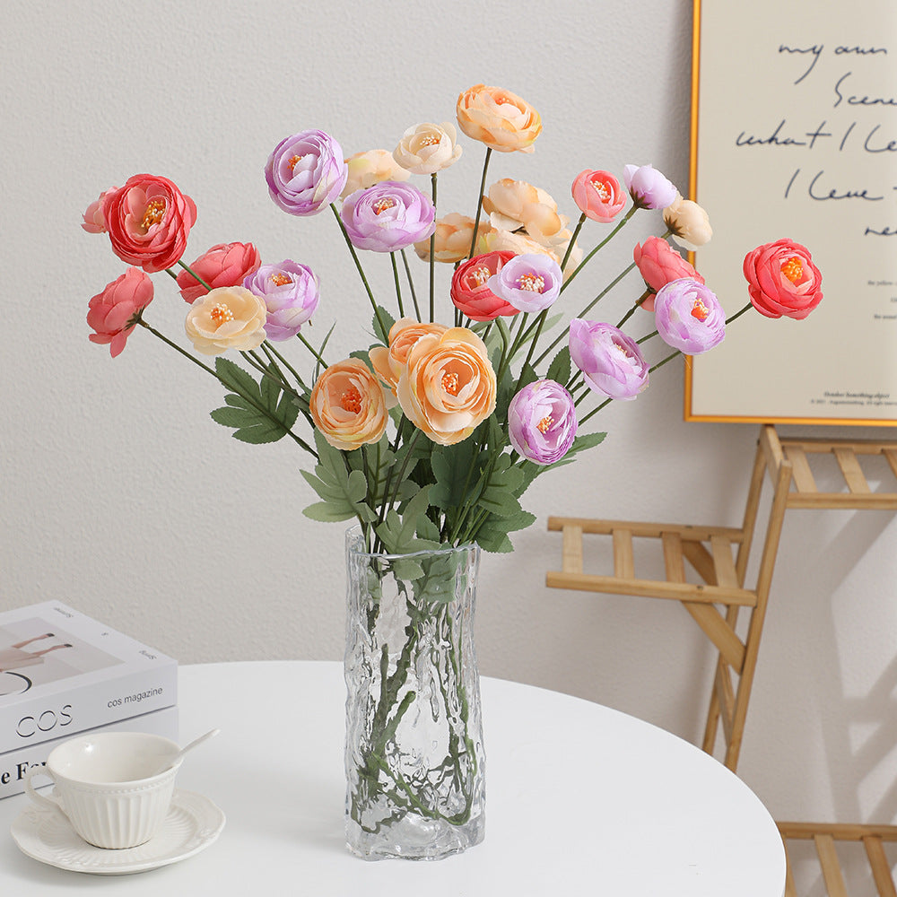 Decorative artificial flower bouquet with intricately detailed ranunculus