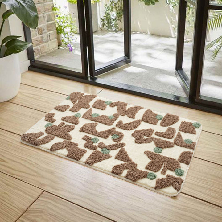 Tufted bathroom mat in abstract leopard pattern with soft high pile