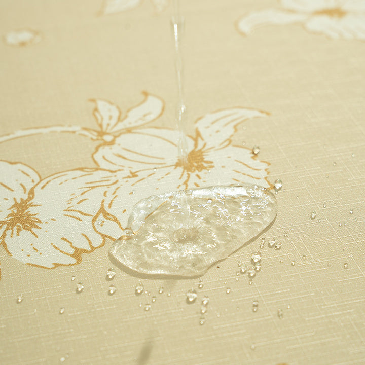 Round wipeable tablecloth with floral cut-out hem