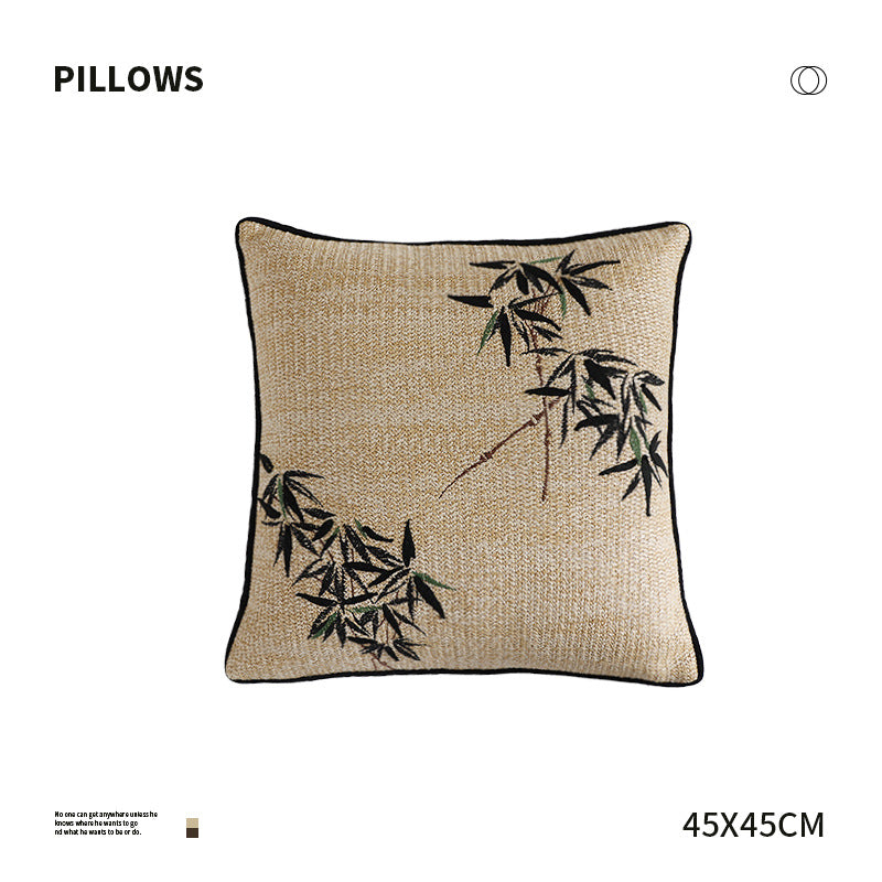 Square decorative pillow with embroidered bamboo design and natural linen texture