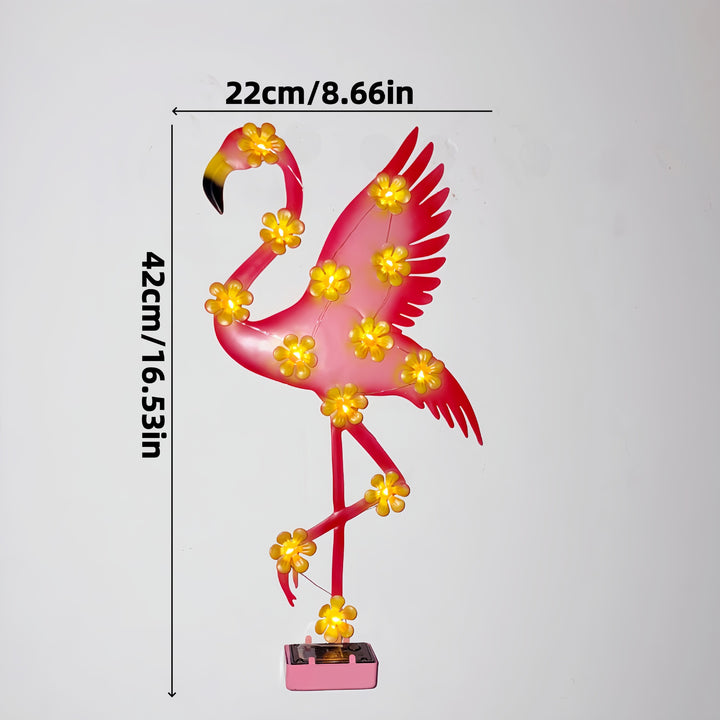 Solar-powered Flamingo LED garden stake light with flower accent lamps