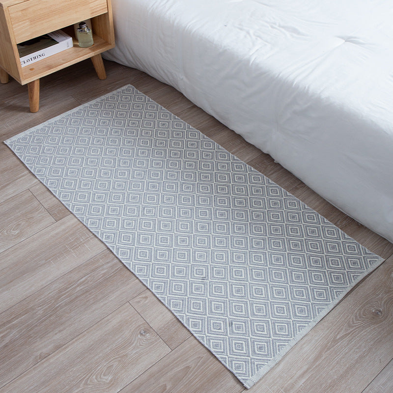 Flat-woven runner rug with check pattern and decorative border stripe