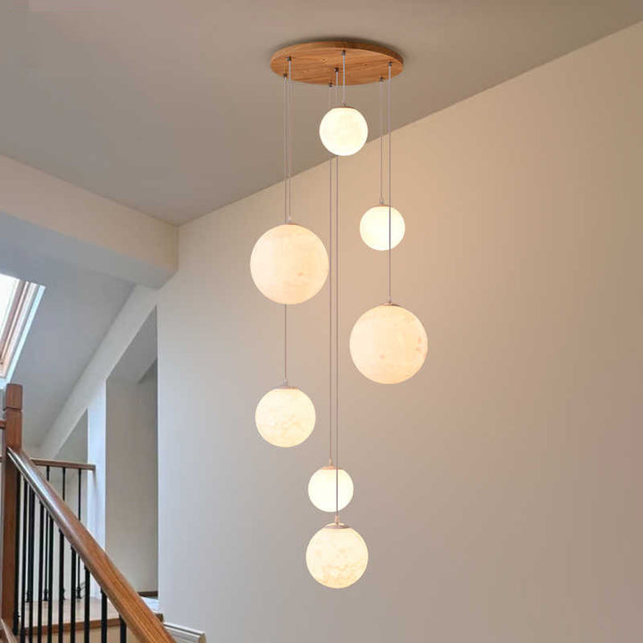 Cascading glass globe pendant lamp with wooden ceiling