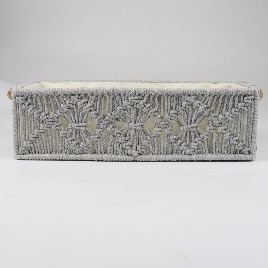 Storage basket with macrame pattern