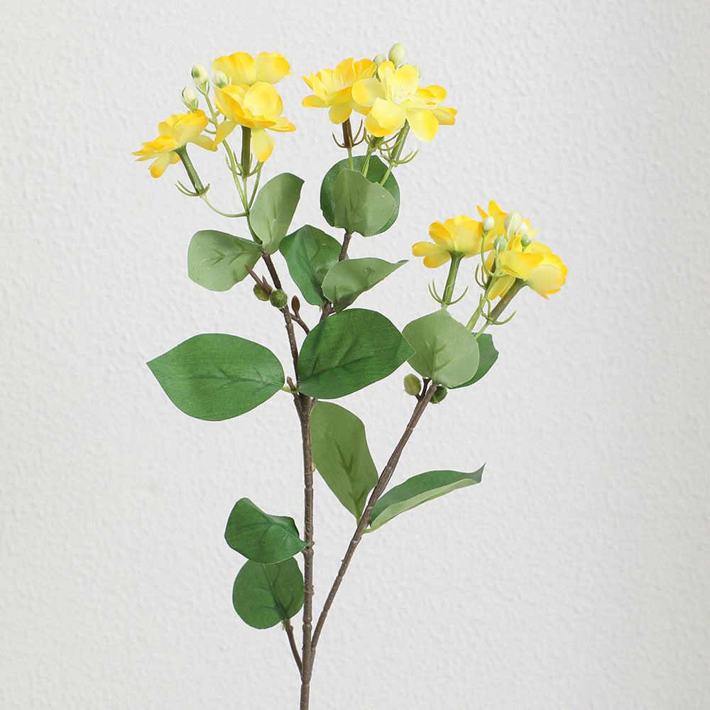 Artificial flower branch with vibrant pink flowers