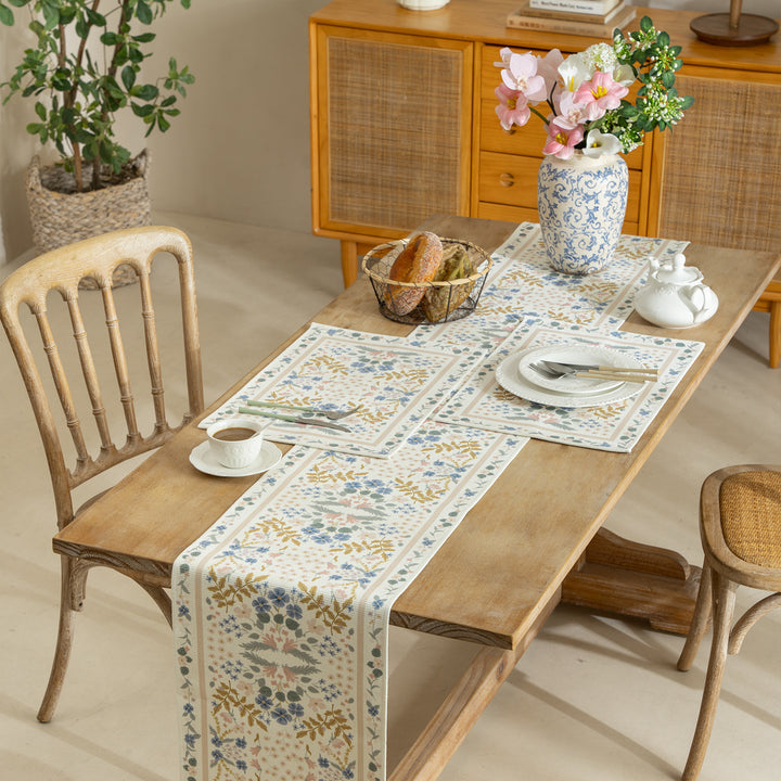Woven runner with vintage-oriental floral pattern and fringes