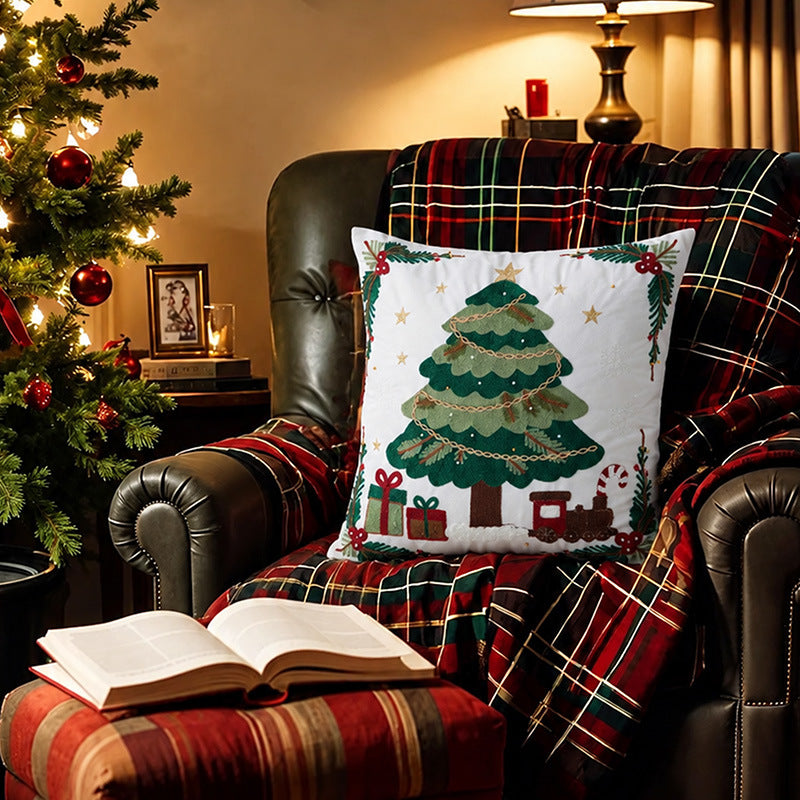Festive embroidered decorative pillow with reindeer motif and removable cover