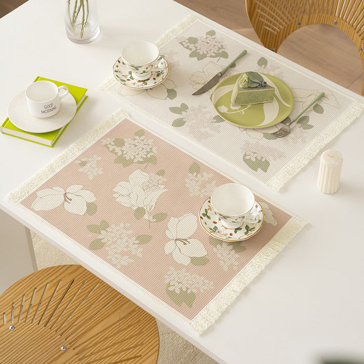 Floral woven bath mat with decorative fringes