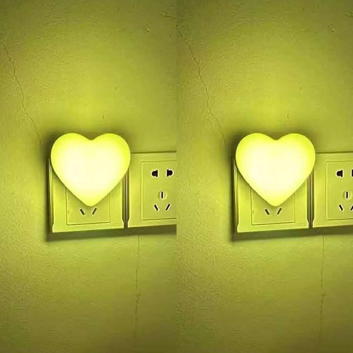 Heart-shaped plug-in ambient night light with soft LED lighting