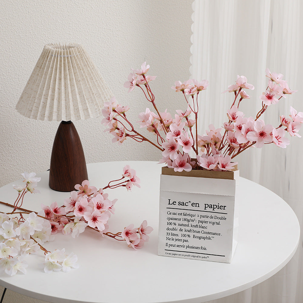 Artificial cherry blossom branch with detail-loving flowers