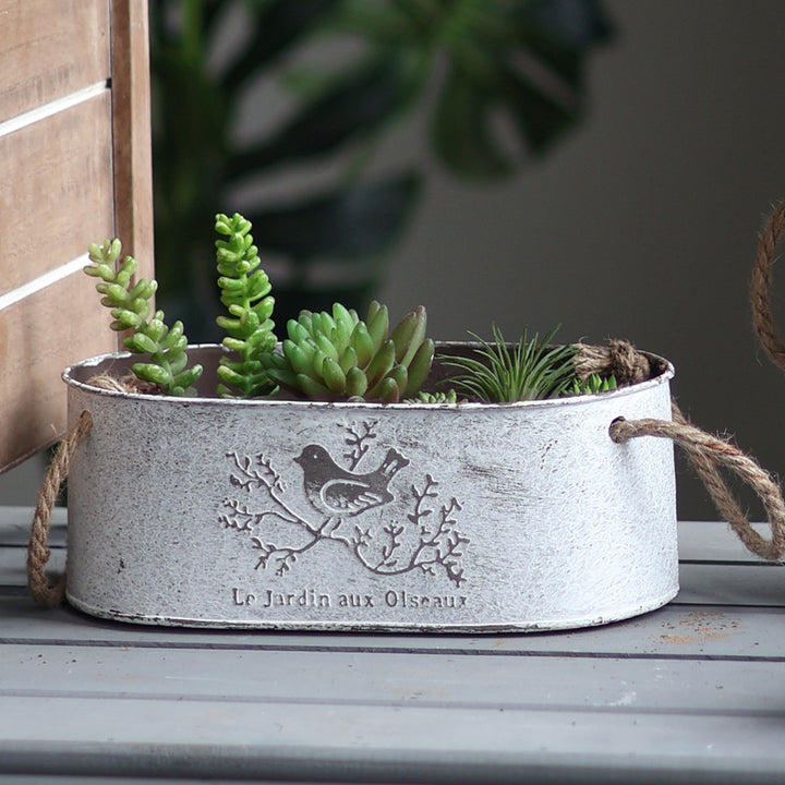 Decorative storage basket made of metal with natural design
