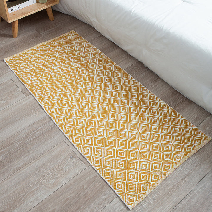 Flat-woven runner rug with check pattern and decorative border stripe