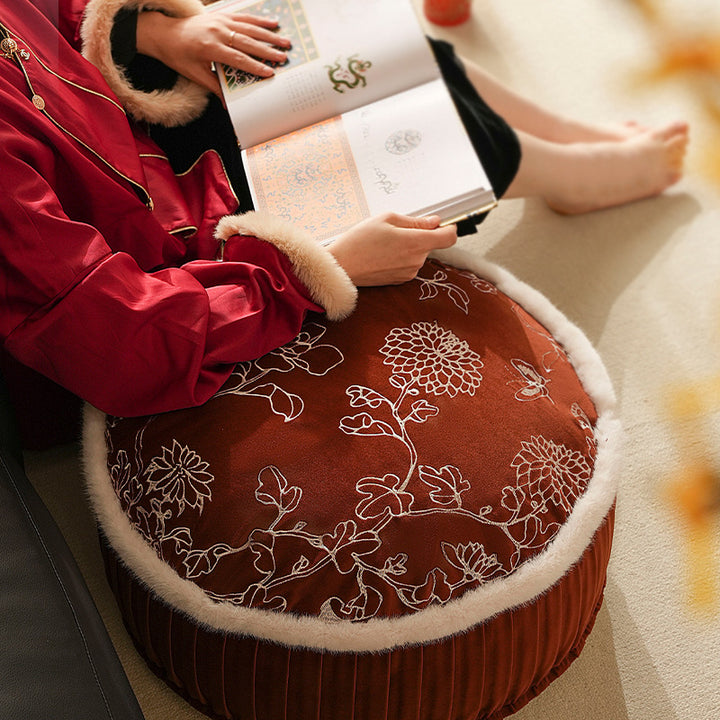 Round velvet decorative bench with floral embroidery and faux fur trim