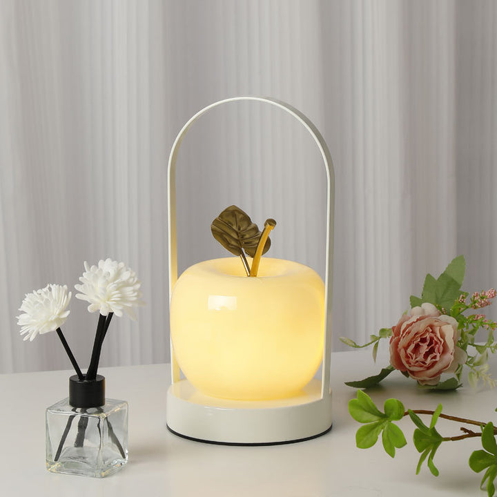 Ceramic apple-shaped ambient table lamp with brass handle