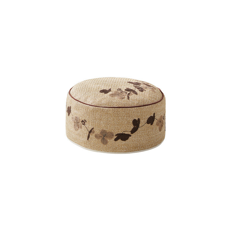 Round floor pouf seating with embroidered floral border