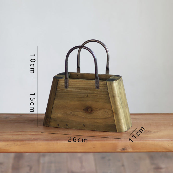 Handcrafted wooden basket with metal handles