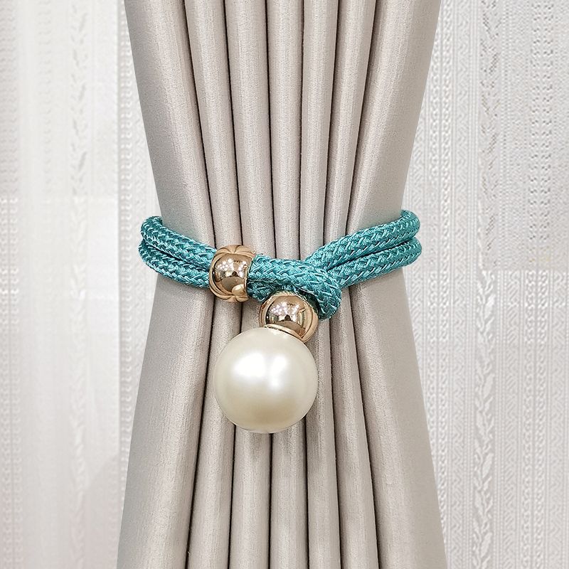 Elegant curtain tieback with decorative pearl