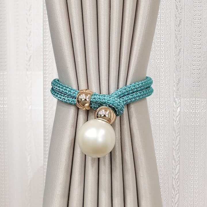 Elegant curtain tieback with decorative pearl