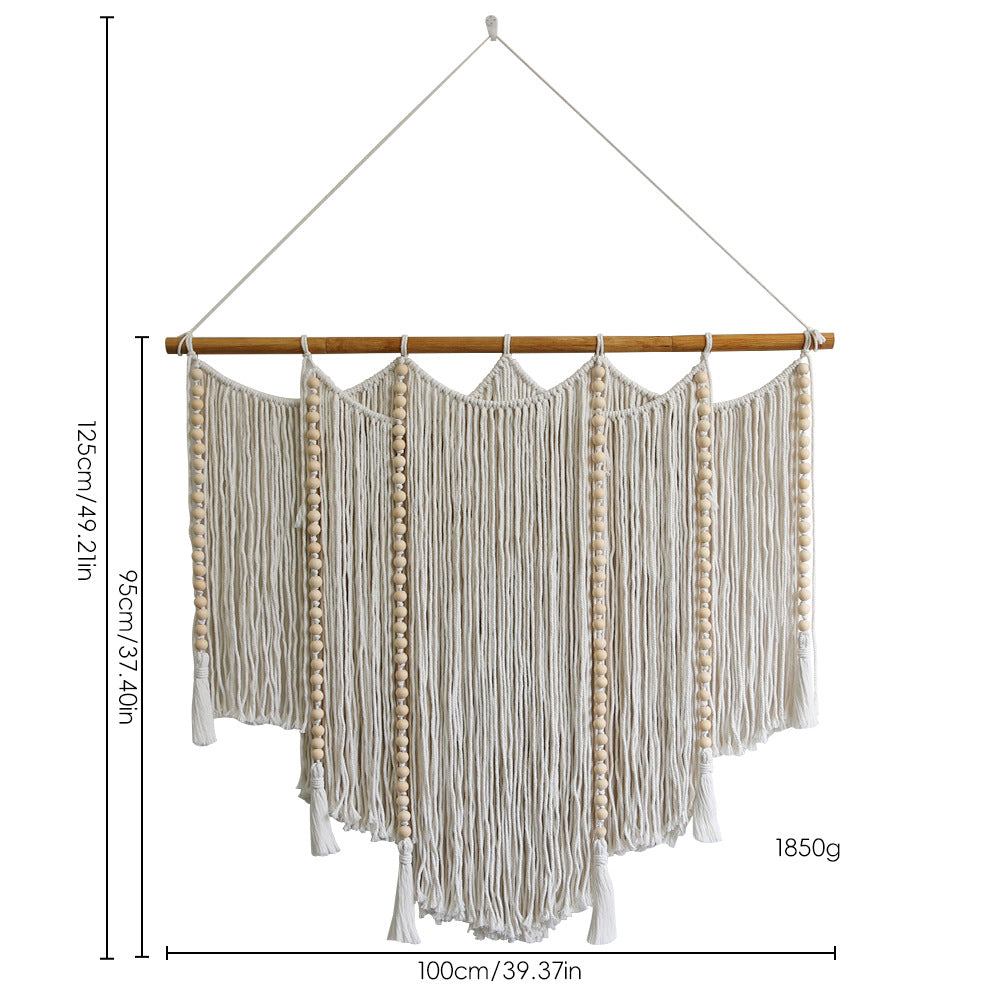 Macramé wall hanging with intricate fringes and wooden beads