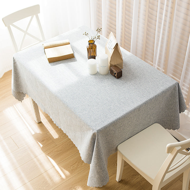 Rectangular tablecloth in linen look with wavy arc edge