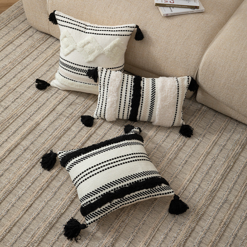 Handwoven decorative cushion cover made of cotton blend with tassels and structured stripe look