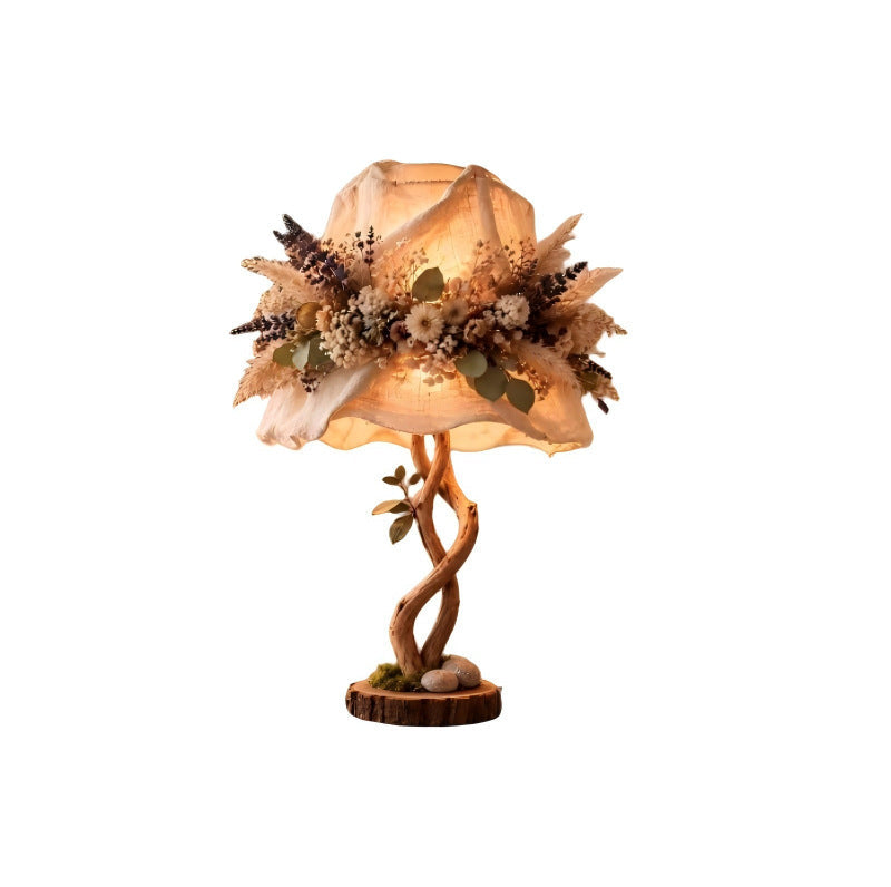 Decorative table lamp with floral elements