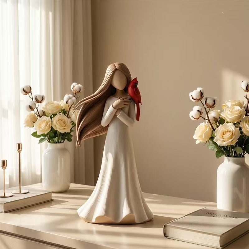 Figurine Holding Bird