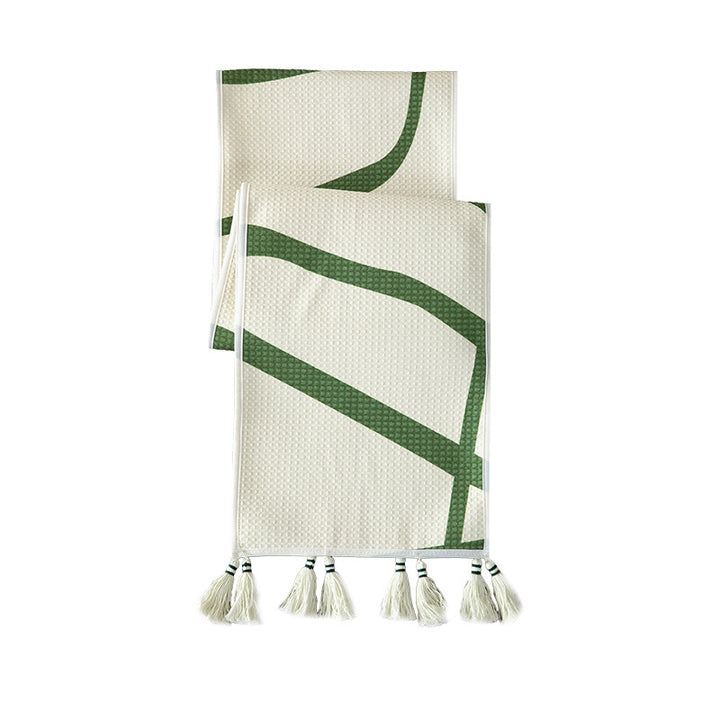 Light waffle texture throw blanket with geometric print and tassels