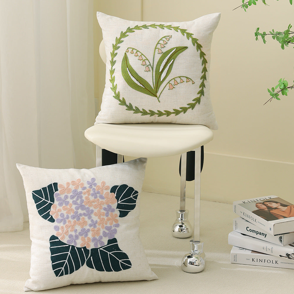 Square bouclé decorative cushion with tufted flower appliqué