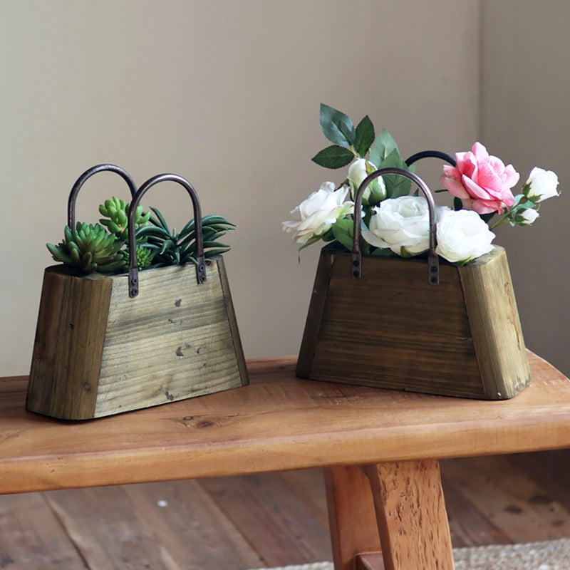Handcrafted wooden basket with metal handles