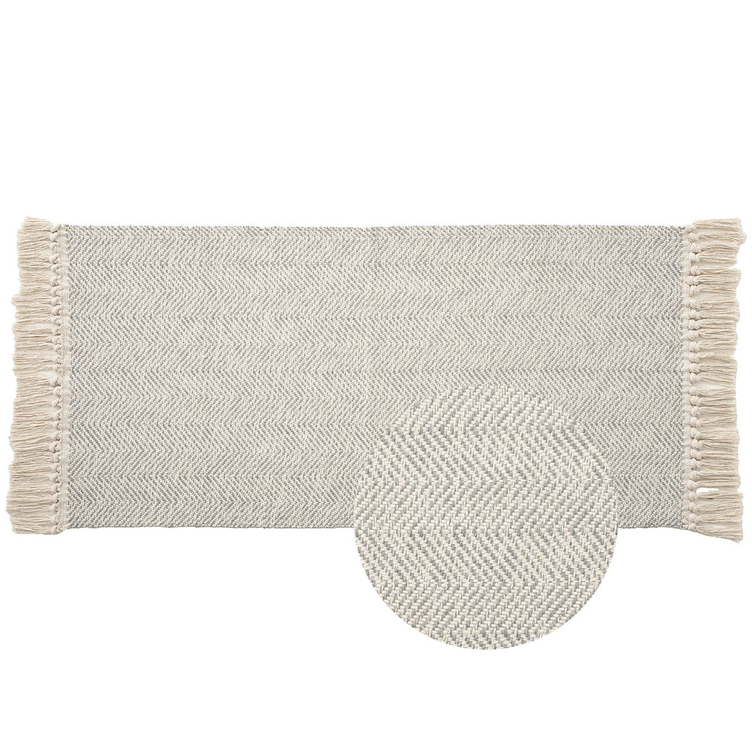 Handwoven runner rug with chevron weave and long fringes