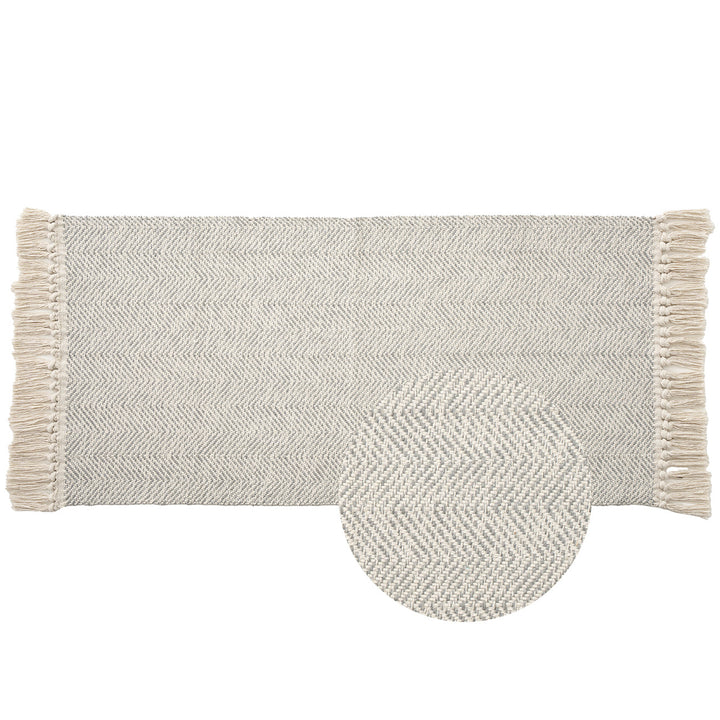 Handwoven runner rug with chevron weave and long fringes