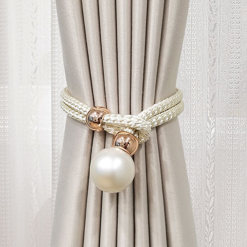 Elegant curtain tieback with decorative pearl