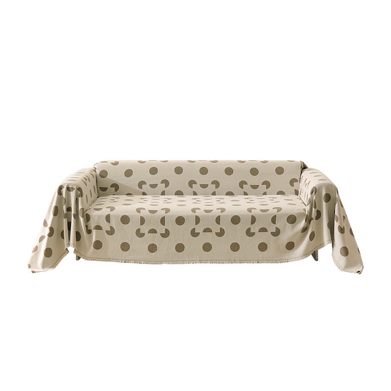 three-seater universal protective cover made of jacquard fabric with geometric pattern