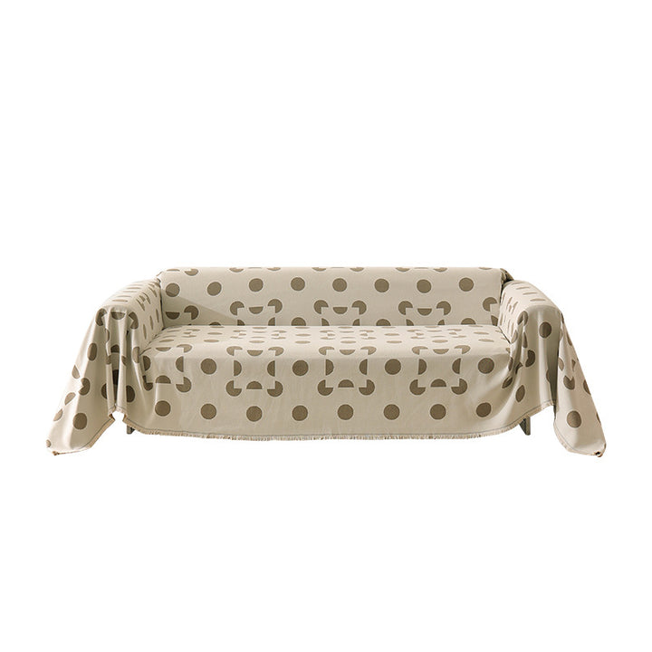 three-seater universal protective cover made of jacquard fabric with geometric pattern