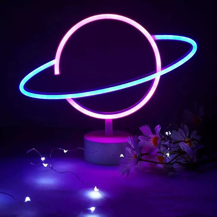 Saturn-inspired LED orb table lamp with dual-colored neon rings
