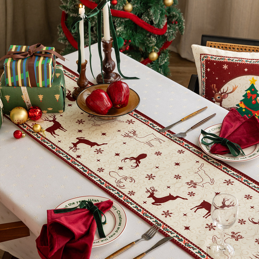 Table runner made of cotton blend fabric with a Christmas reindeer and star motif