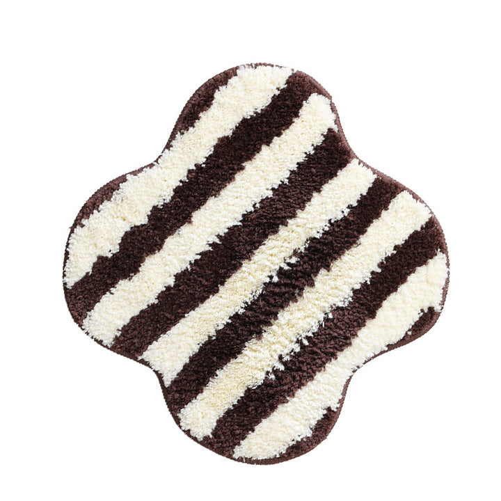 High-pile bath mat rug with diagonal stripe structure and organic shape