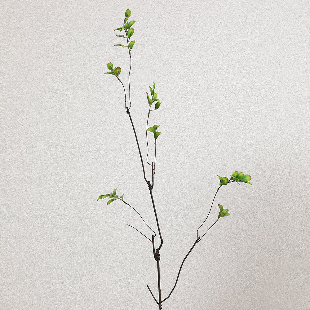 Artificial flower branch with vibrant orange flowers