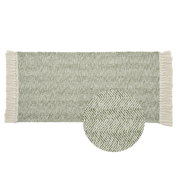Handwoven runner rug with chevron weave and long fringes
