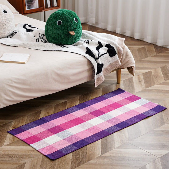 Flat-woven runner rug with check pattern and decorative border stripe