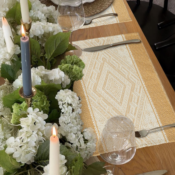 Woven rectangular table mats in a set with ethnic geometric pattern and easy-care cotton blend